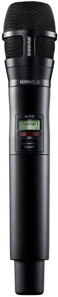 Black wireless handheld microphone with mesh grille, LCD screen showing channel info, and power switch.