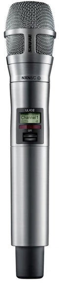Silver handheld wireless microphone with metal grille and small screen displaying Channel 1.