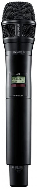 Black handheld wireless microphone with display showing Channel 1 and Shure branding.