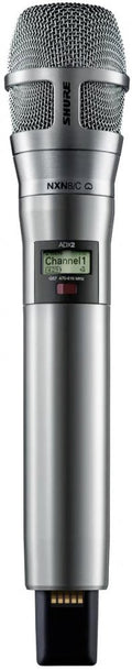 Silver handheld wireless microphone with digital display showing channel information and connector pins at the bottom.