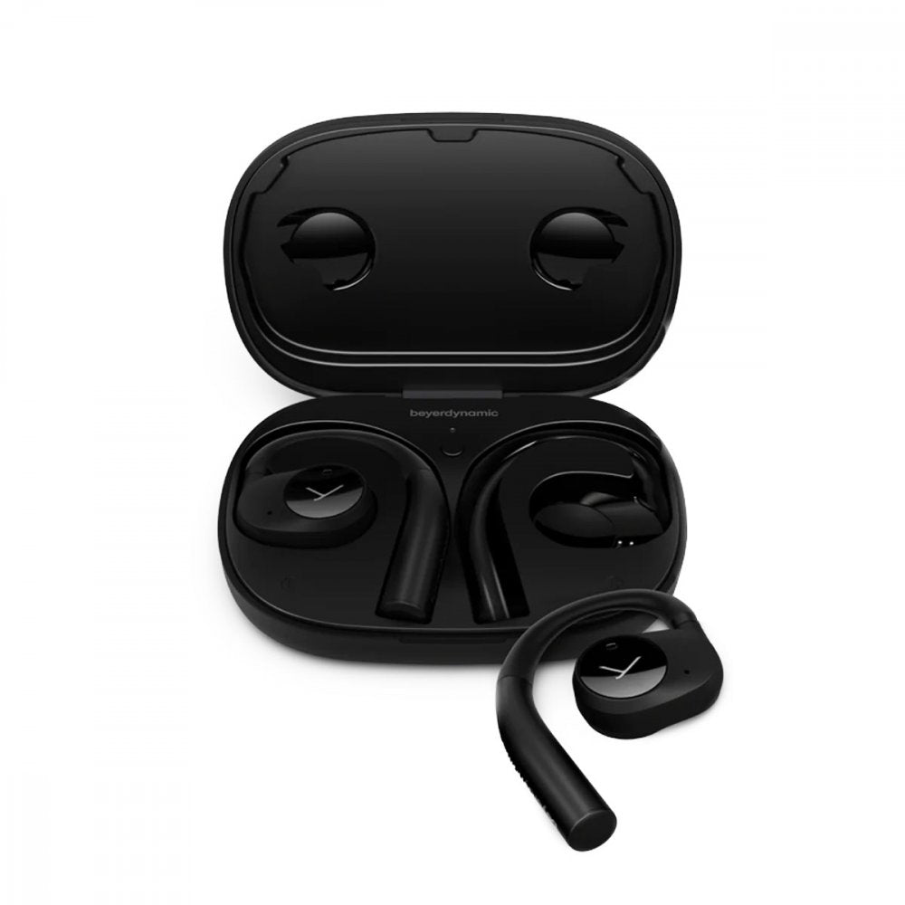 Black wireless earbuds with hook design inside an open charging case with beyerdynamic branding.
