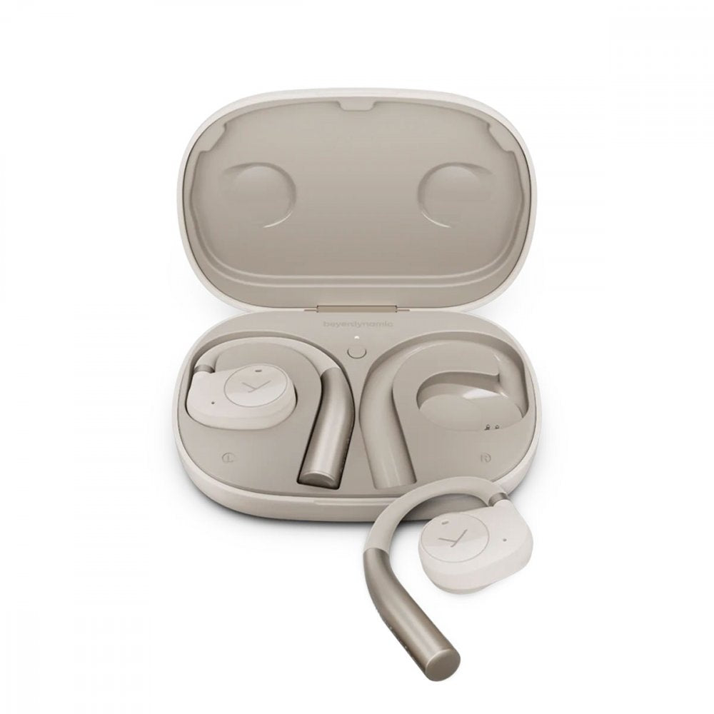 Cream-colored wireless earbuds with ear hooks and a matching charging case shown open.