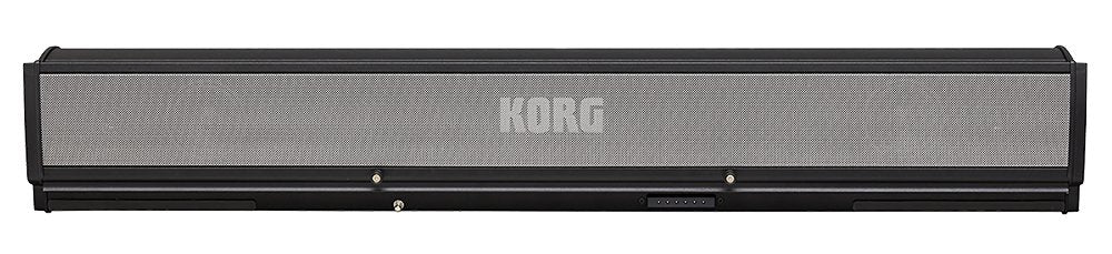 Rectangular black and gray KORG device with mesh front and no visible controls or connectors