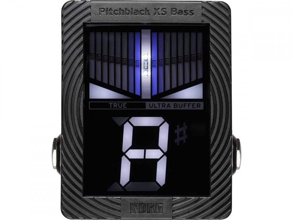 Black rectangular pedal tuner with digital display showing note A# and side input/output jacks.