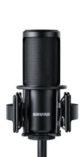 Black Shure microphone with shock mount and cylindrical connector at the bottom on white background.