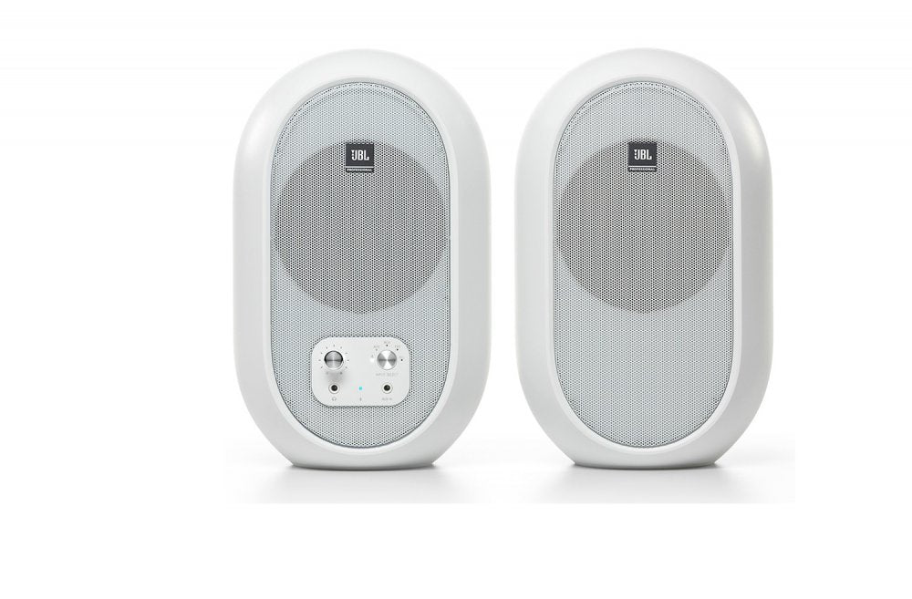 Pair of white JBL speakers with front metal grills and control panel on one speaker