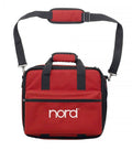 Red and black carrying bag with shoulder strap and 'nord' logo on front pocket.