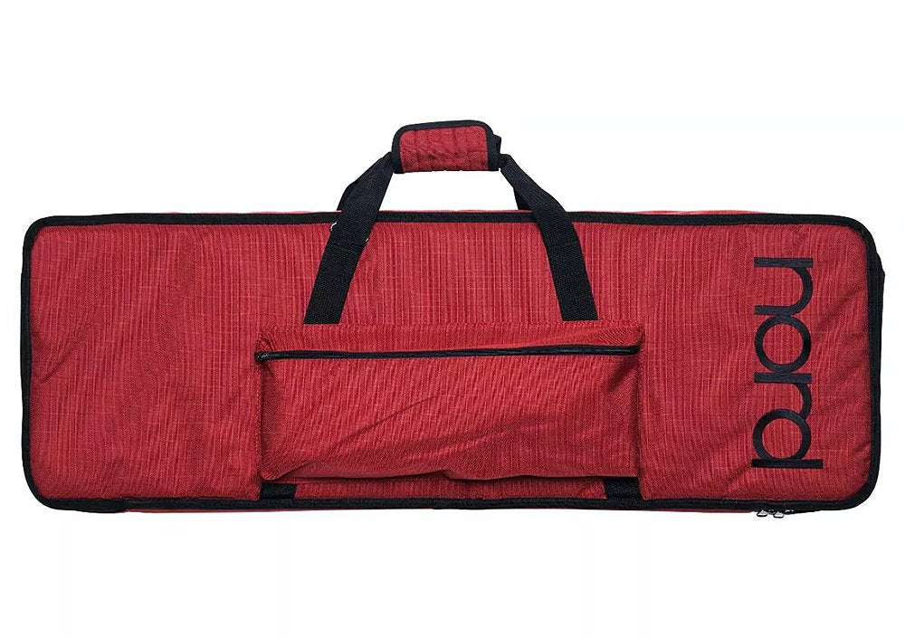 Red padded carrying case with black handles and a front pocket with 'nord' text on the side.