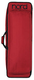 Red fabric carrying case with black 'nord' logo and front pocket, designed for an instrument or equipment.