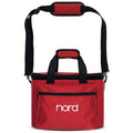 Red soft carrying bag with black handles and shoulder strap printed with "nord" on front pocket.