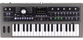 Top-down view of a gray KORG microKORG synthesizer keyboard with various knobs, buttons, and display screen.