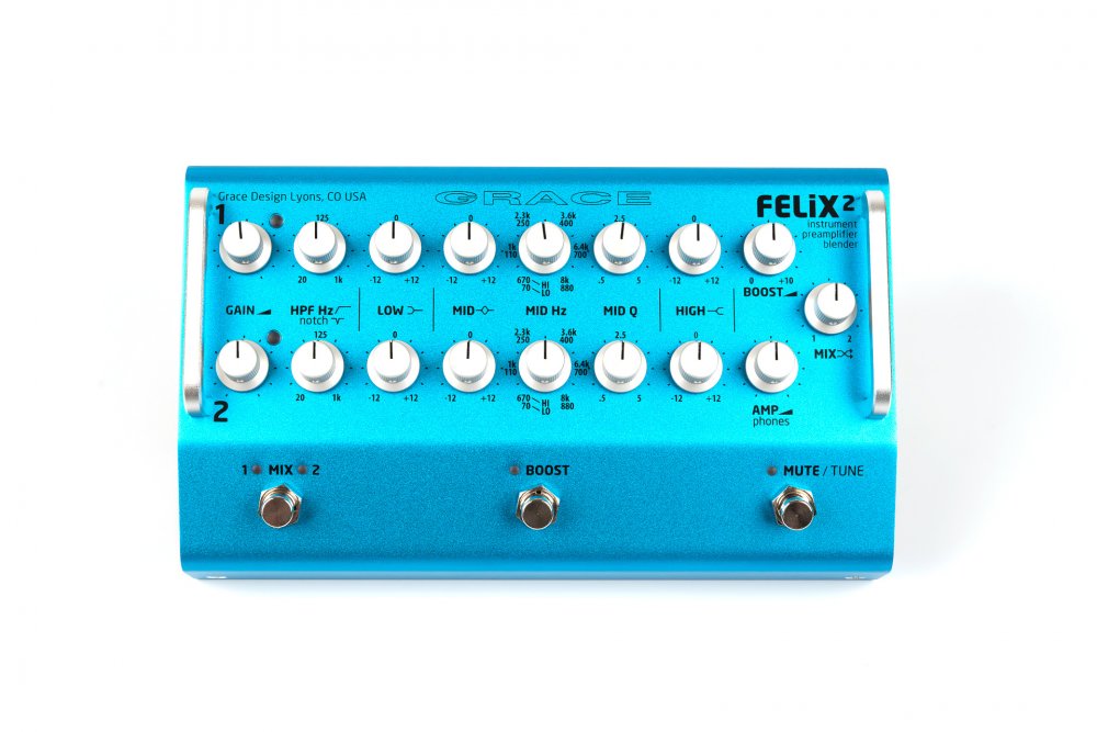 Top view of a blue instrument preamplifier blender with multiple control knobs and three footswitches.