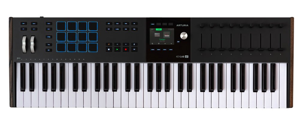 Black MIDI keyboard controller with 61 keys, pads, knobs, buttons, sliders, and a small display by ARTURIA.