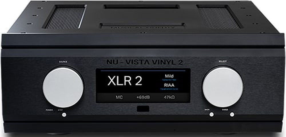 Black audio device with two large silver rotary knobs and a central display showing audio settings.