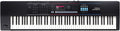 Black Roland JUNO-D synthesizer keyboard with keys, knobs, faders, buttons, and a digital display screen.