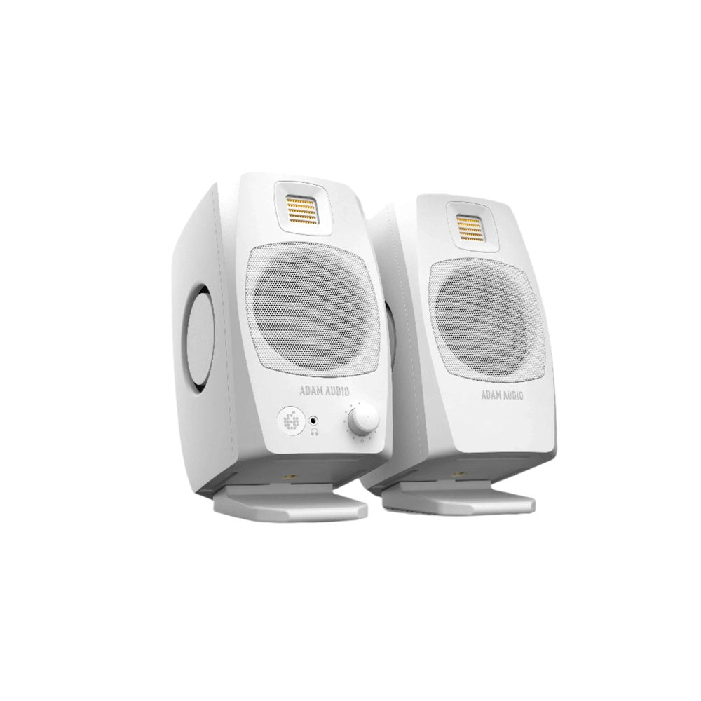 Pair of white studio monitors with metal speaker grilles and controls on the front of one speaker.