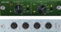 Close-up of an audio device panel showing rotary knobs and XLR output connectors labeled 1 to 4.