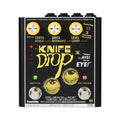 Black Eventide Knife Drop pedal with yellow knobs and eye graphics, featuring two footswitches and various control labels.