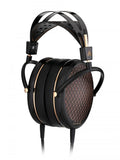 Black and rose gold over-ear headphones with padded headband and wired cable