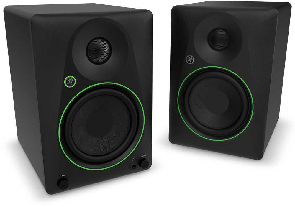 Pair of black studio monitor speakers with green rings, each having a tweeter, woofer, and control knobs.