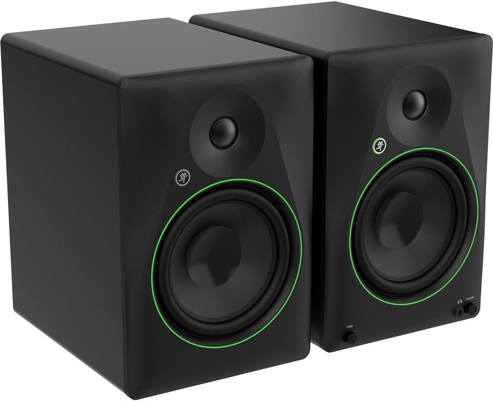 Pair of black studio monitor speakers with green rings, tone and volume knobs, and headphone jack on right speaker.