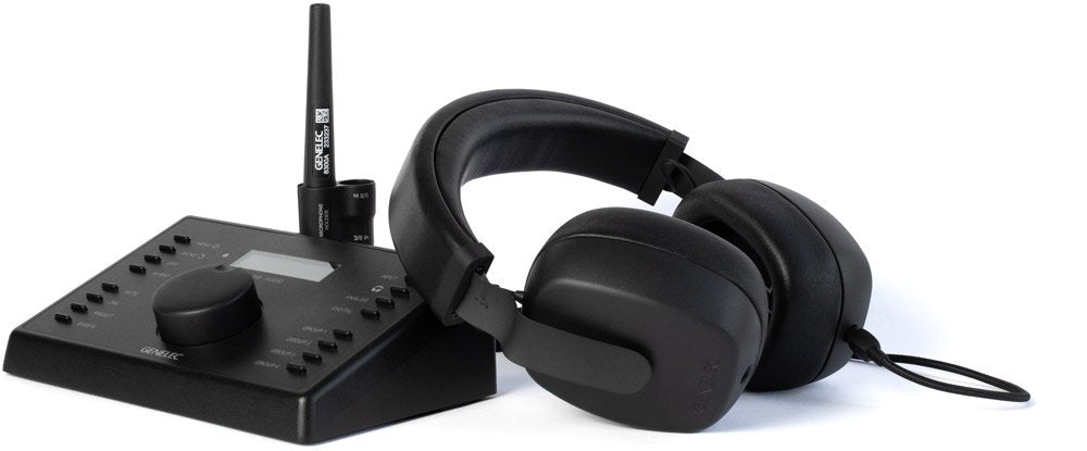 Black monitor controller unit with rotary knob, buttons, antenna and a pair of over-ear headphones.