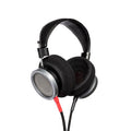 Black over-ear headphones with silver mesh ear cups and a black headband with visible stitching.