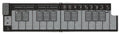 Foldable white and black MIDI controller with multiple pads and buttons labeled for pitch, mod, and pattern controls.