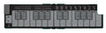 Folded MIDI controller keyboard in alpine green with labeled touch keys and rotary controls, featuring a USB-C connector.