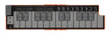 Folded compact MIDI keyboard controller with buttons, sliders, and labeled keys in orange and black.