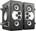 A large freestanding black Barefoot Sound MiniMain12 active studio monitor with a machined aluminum baffle plate holding a ring-radiator tweeter, two midrange cones, and two woofer cones on the front face.