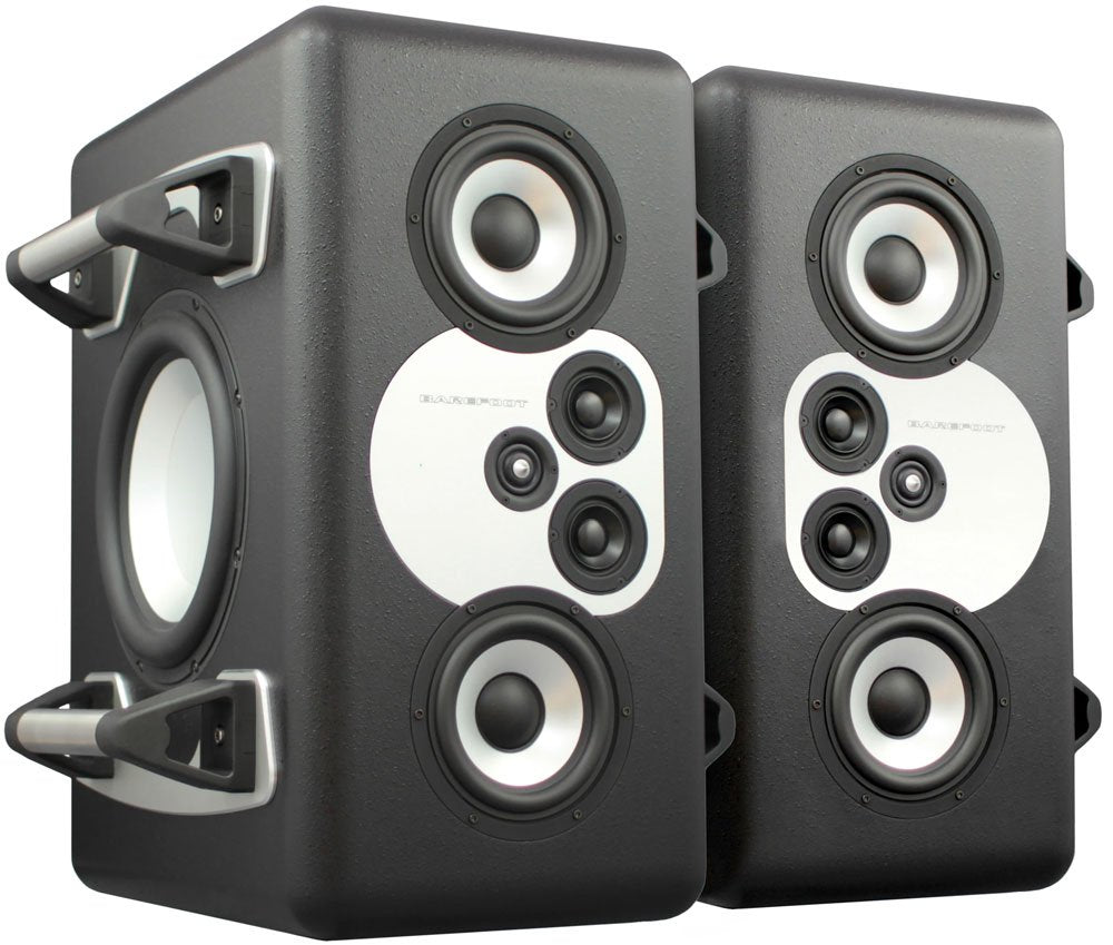 A large freestanding black Barefoot Sound MiniMain12 active studio monitor with a machined aluminum baffle plate holding a ring-radiator tweeter, two midrange cones, and two woofer cones on the front face.