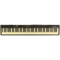 Black keyboard synthesizer with white keys and multiple sliders, knobs, and buttons across the top panel.