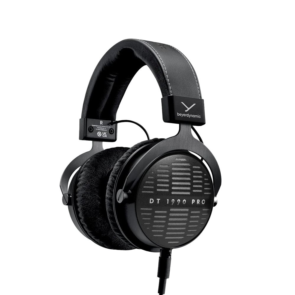 Black over-ear headphones with visible cable connector and cushioned ear pads, labeled DT 1990 PRO