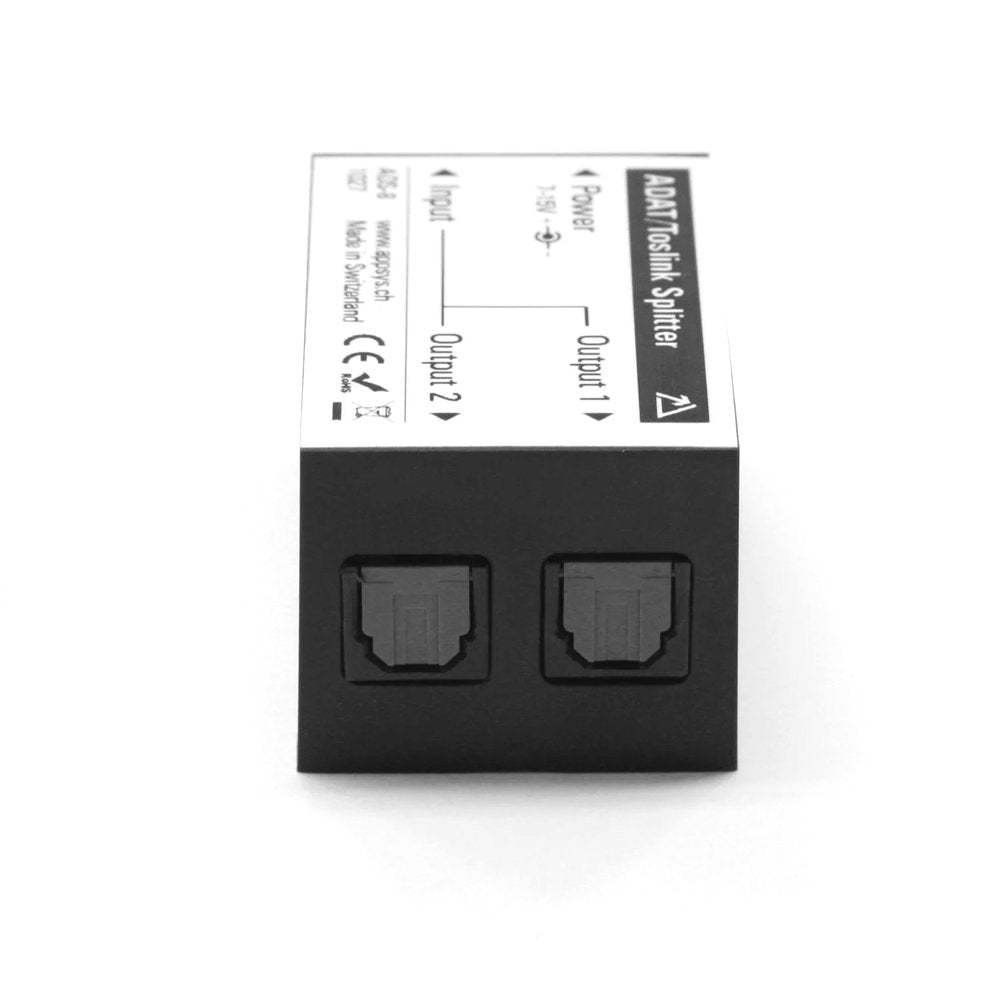 Black and white ADAT Toslink splitter with two output optical ports and one input optical port visible on top.