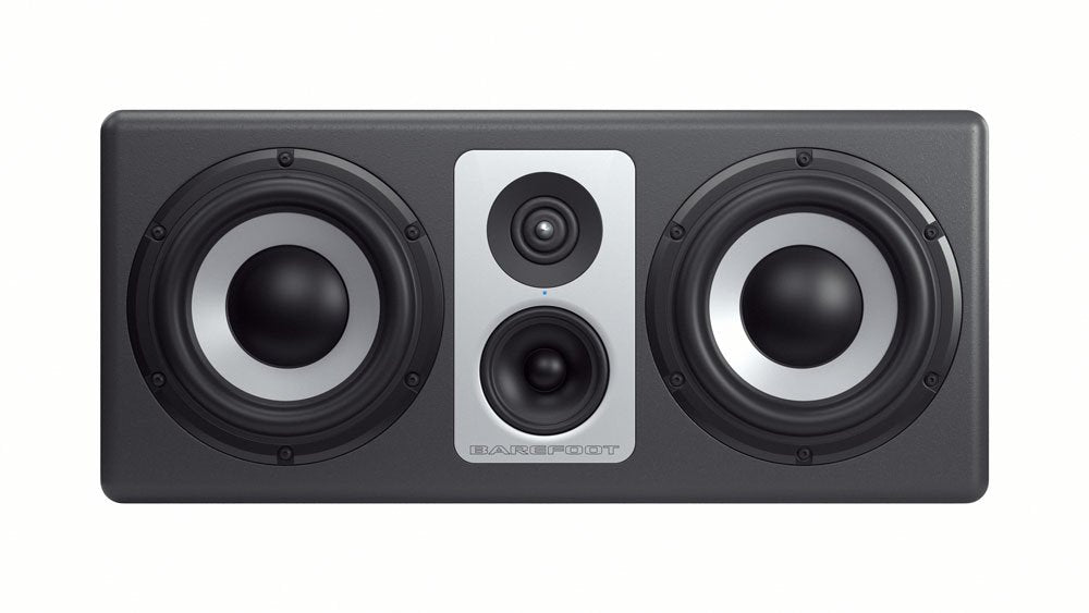 Front view of a rectangular black studio monitor speaker with two large drivers and two smaller drivers in the center.
