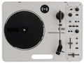 Top view of a Korg handytraxx play DJ turntable with various control knobs, faders, and switches on a gray surface.