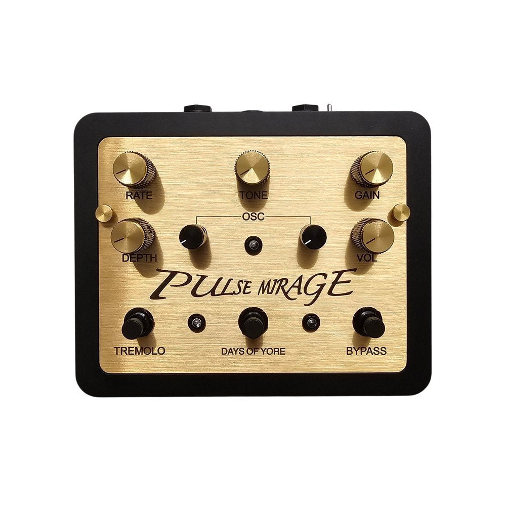 Black and gold guitar effects pedal with knobs for rate, depth, tone, gain, and volume, and footswitches labeled tremolo and bypass.