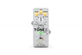 Small white guitar effect pedal with one large knob, three yellow LED indicators, one green LED, and a footswitch.