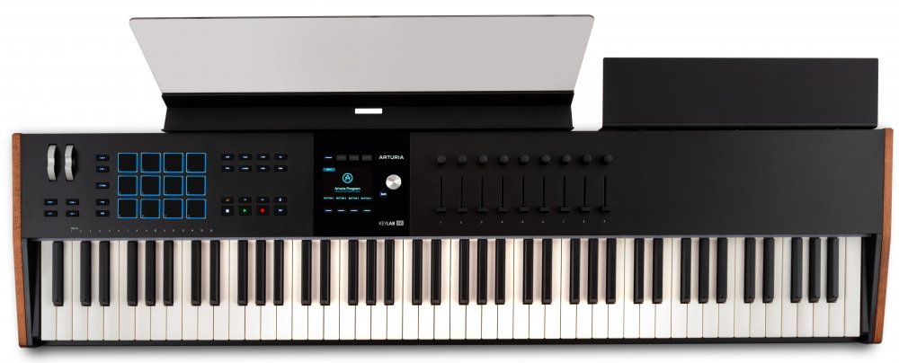 Black MIDI keyboard controller with 88 keys, pads, knobs, faders, buttons, and a small display screen.
