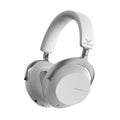 White and grey over-ear headphones with padded headband and ear cups, showing buttons and ports on the ear cup edge.