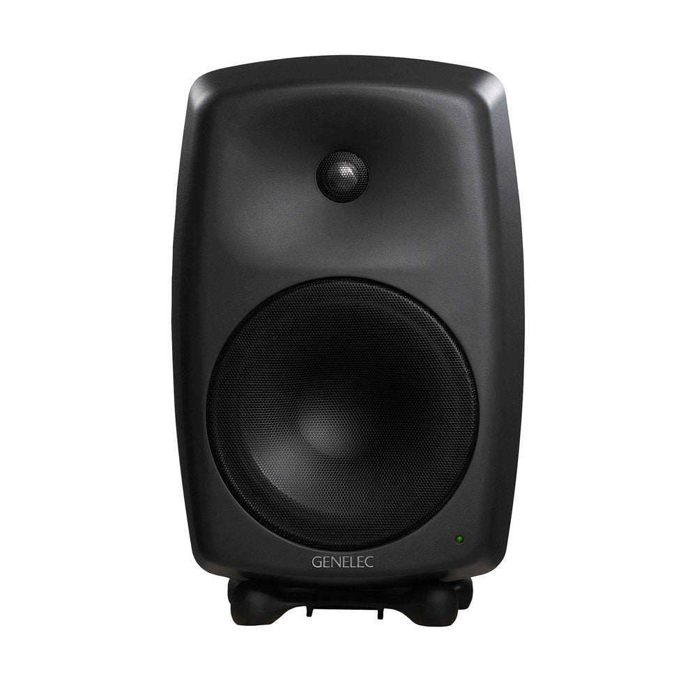 Black studio monitor speaker with metal mesh covering two drivers and a green power indicator light.
