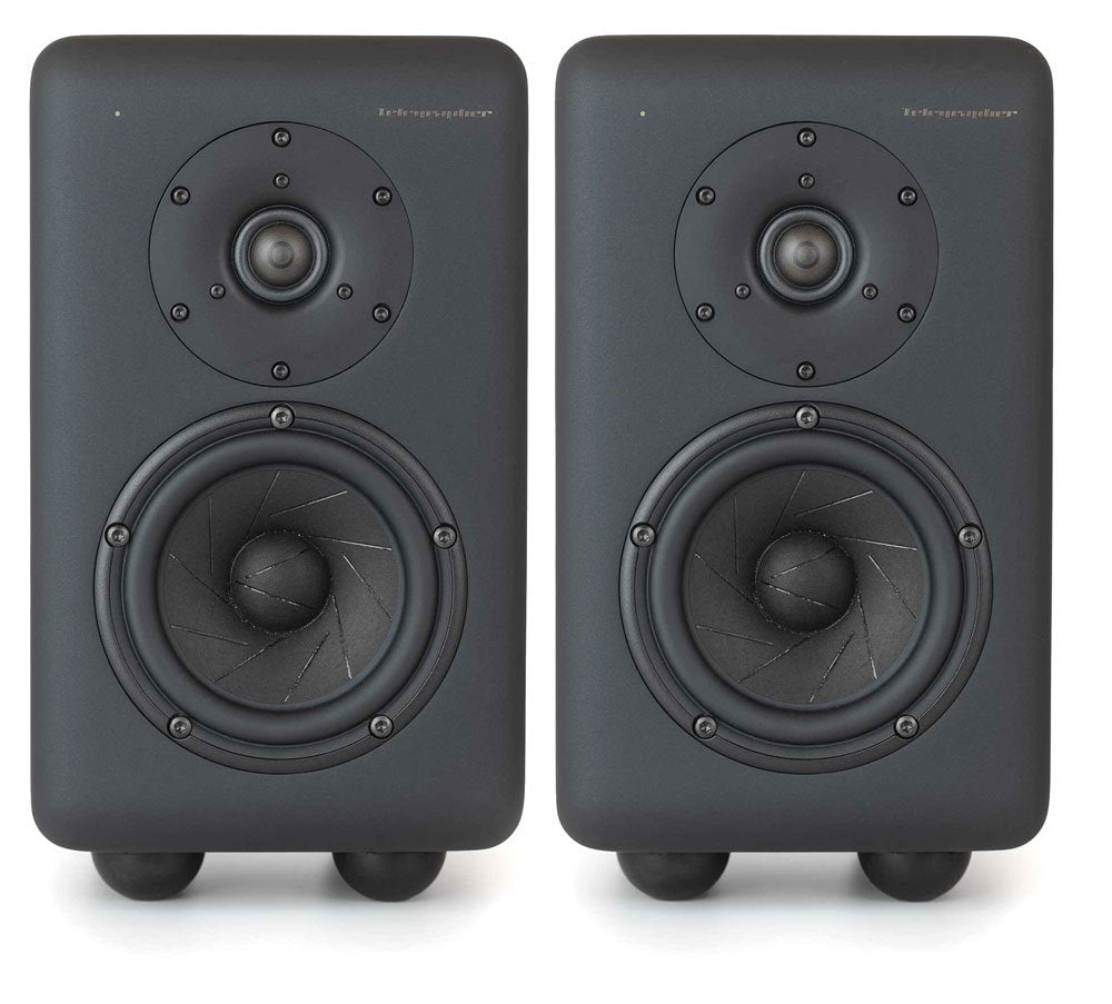 Pair of black studio monitors with large woofers and tweeters on front side.