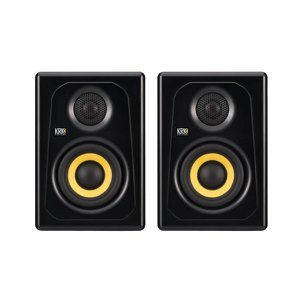 Pair of black studio monitors with yellow speaker cones and KRK Systems logo on front.