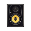Black studio monitor speaker with yellow woofer cone and black tweeter, showing KRK Systems logo.