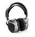 Silver and black over-ear headphones with padded headband and ear cups shown on white background.