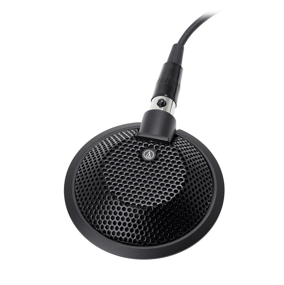 Black round desktop microphone with metal mesh grille and attached XLR cable connector.