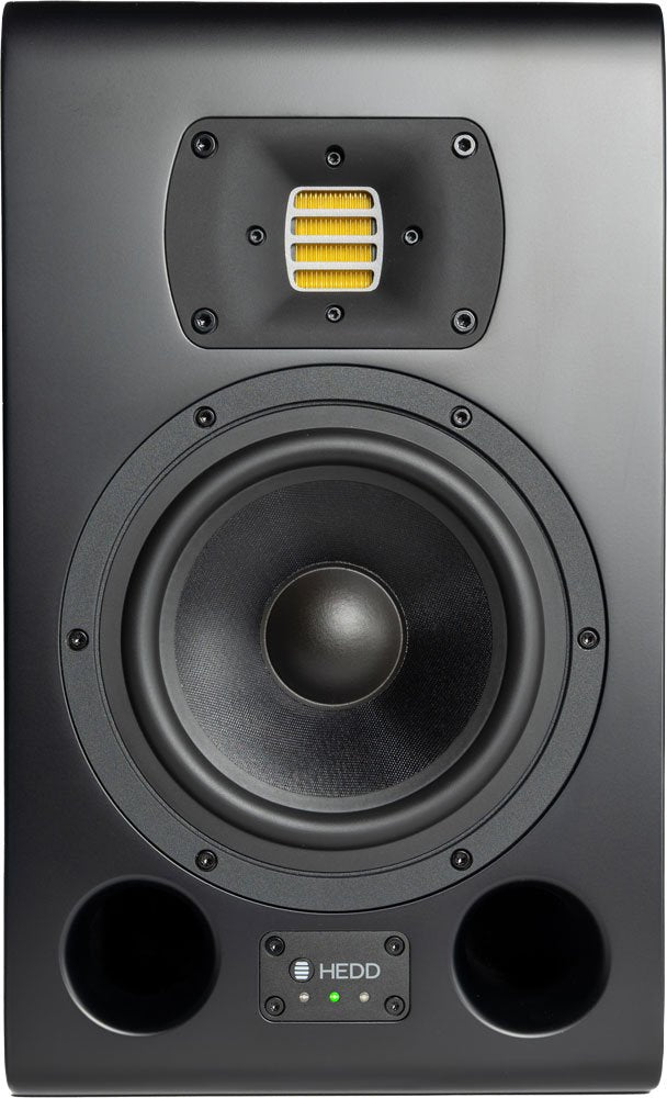 Front view of a black studio monitor speaker with yellow tweeter and bass ports at the bottom.