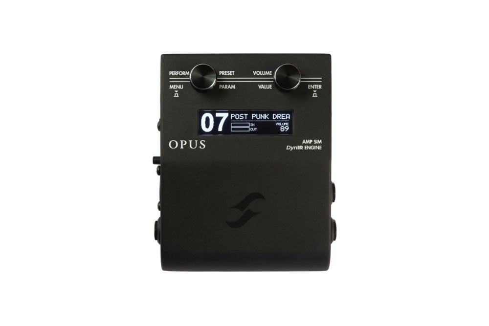 Black rectangular amp simulator device with a screen, two rotary knobs, and side audio jacks.