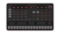 Top view of a black IK UNO Synth with rotary knobs, buttons, touch pads, and a small digital display showing 127